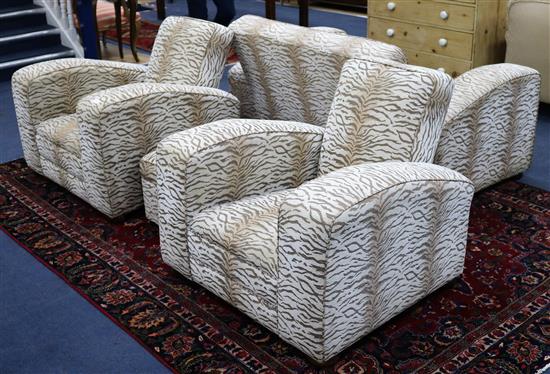 A 1930s Art Deco three piece suite, re-upholstered in tiger skin style fabric, sofa W.166cm